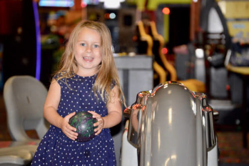 Child playing mini bowling at iT'Z